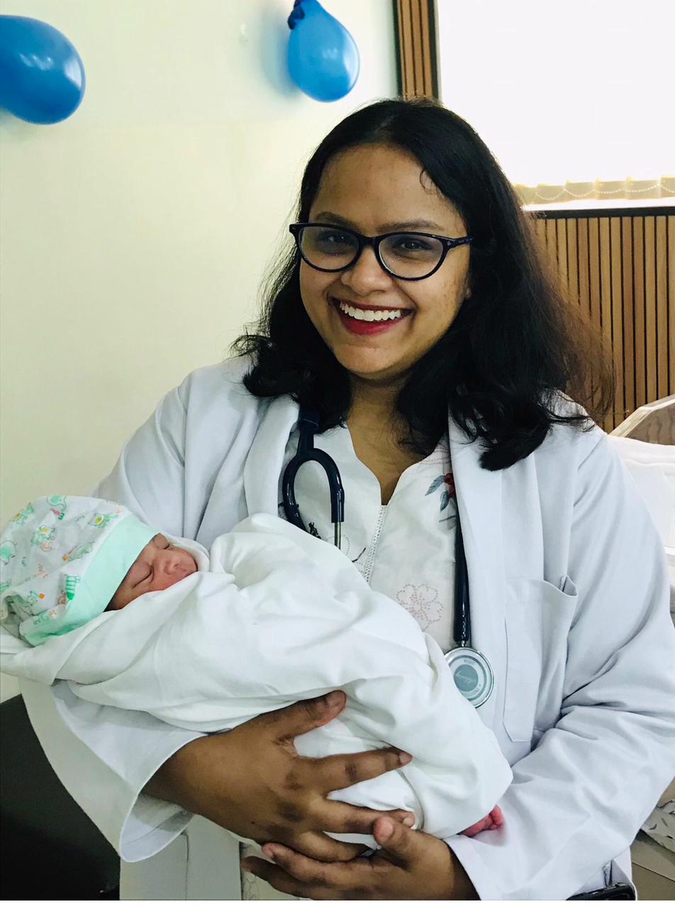 Dr. Anam Ghani with newborn after delivery